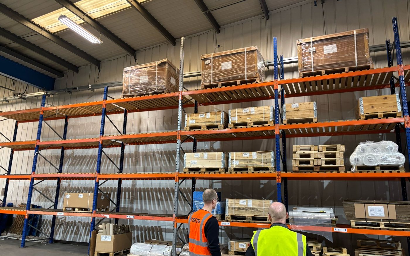 GB surveying a client unit, walking the loaded racking before a move